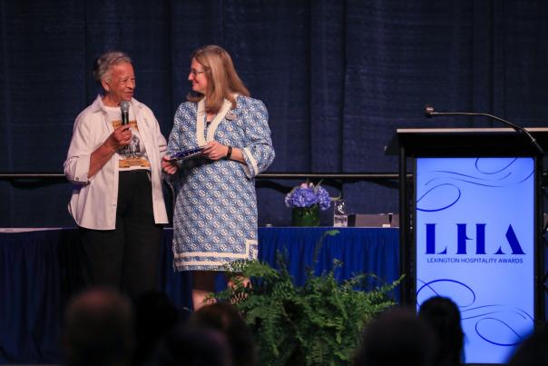 Two women on stage at awards ceremony