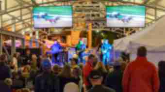 People enjoying live music and horse races at the Breeders' Cup Festival