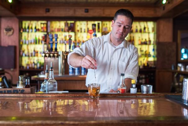 Bartender making Old Fashioned.