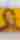 Photorealistic, bright yellow mural of Louis Armstrong smiling and holding his trumpet up to play. The words "I love you" and "What a wonderful world" are painted on the left hand side of the mural.