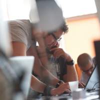 Group of young engineers collaborating on a project