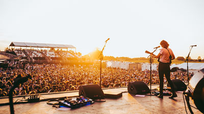 Brandi Carlile plays to hundreds at sunset during the Railbird Music Festival.