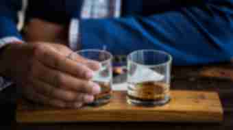 Two glasses of bourbon.