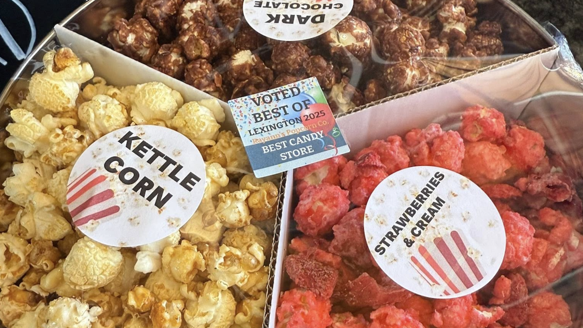 Tin of three different popcorn flavors: Kettle Corn, Strawberries & Cream, and Dark Chocolate